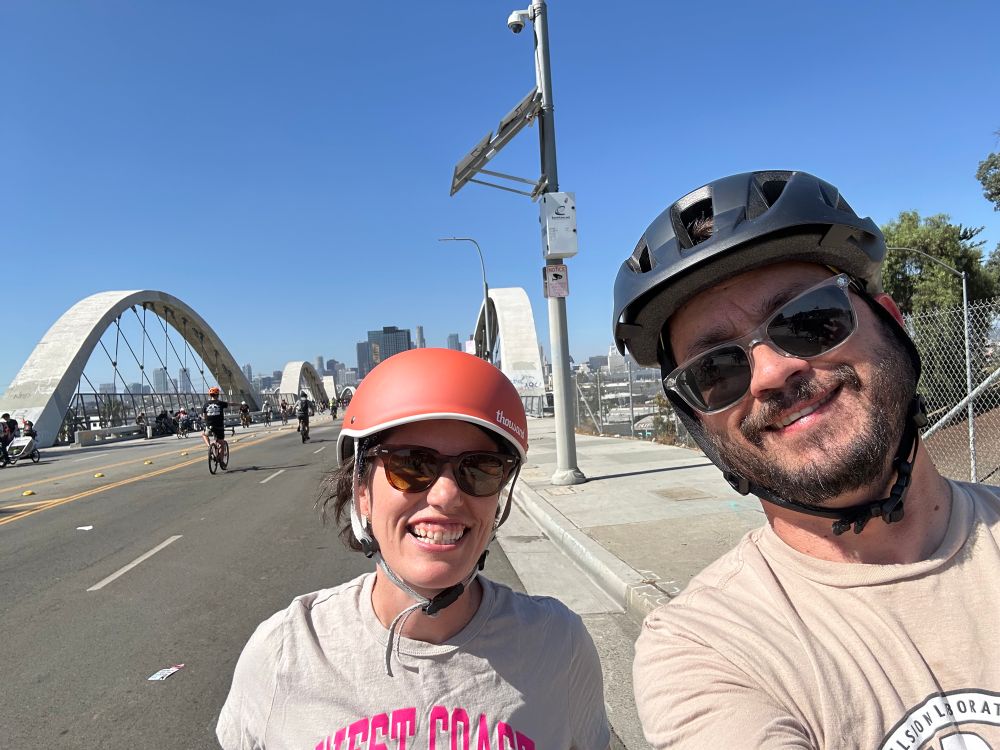 Looking over the 6th Street bridge across the LA River back towards DTLA. Selfie with Emily and me in the foreground. 