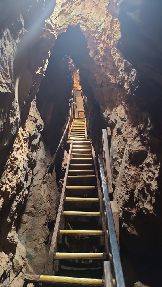 A long narrow staircase in a cave