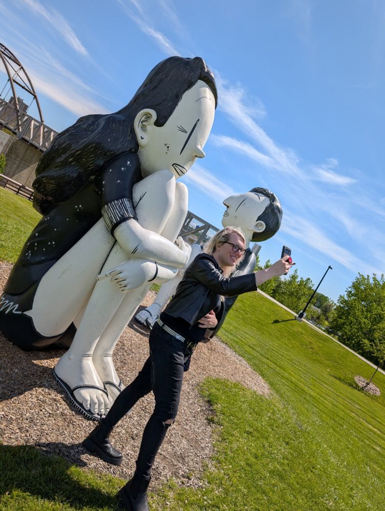 My girlfriend, Katiya, taking a selfie in front of the Small Giants statues at Wendy Park 