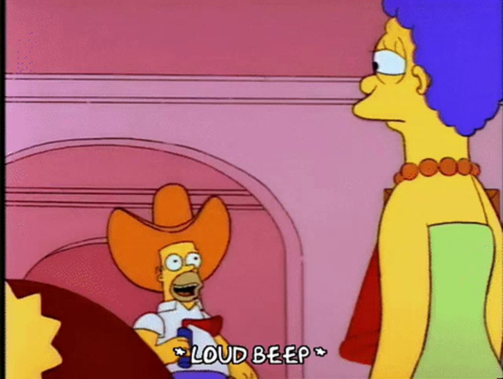 a cartoon of homer simpson wearing a cowboy hat talking to marge simpson .