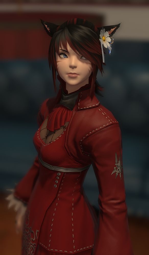 A Miqo'te woman with pale skin and red and black hair.