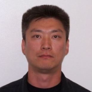 A profile photograph of Senior Lead Officer Harry Cho wearing a dark shirt.
