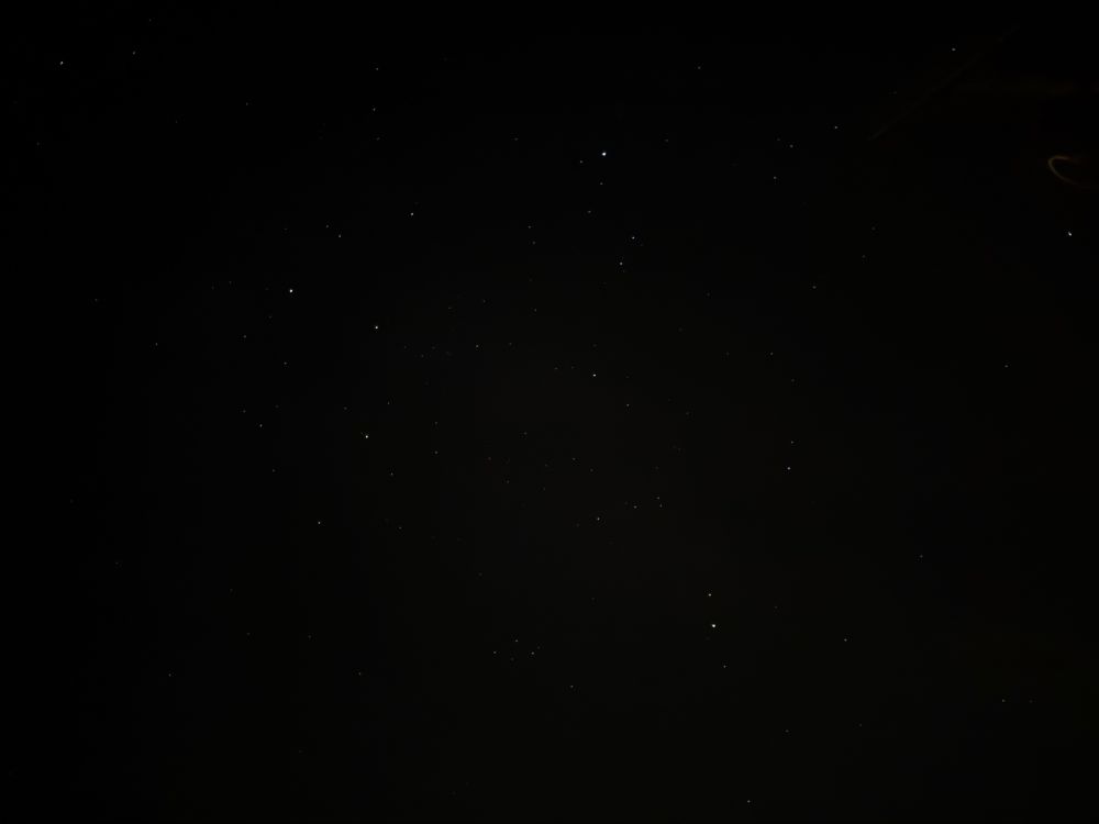 Speckled novae against a pitch backdrop 