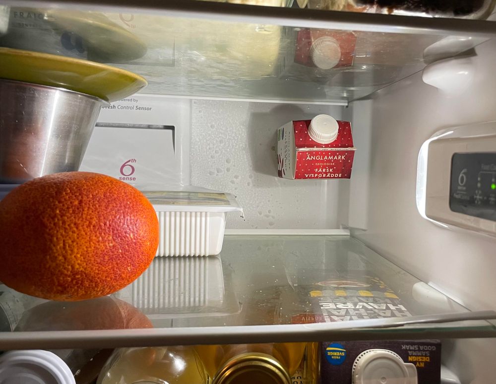 Just a packet of cream levitating in our fridge