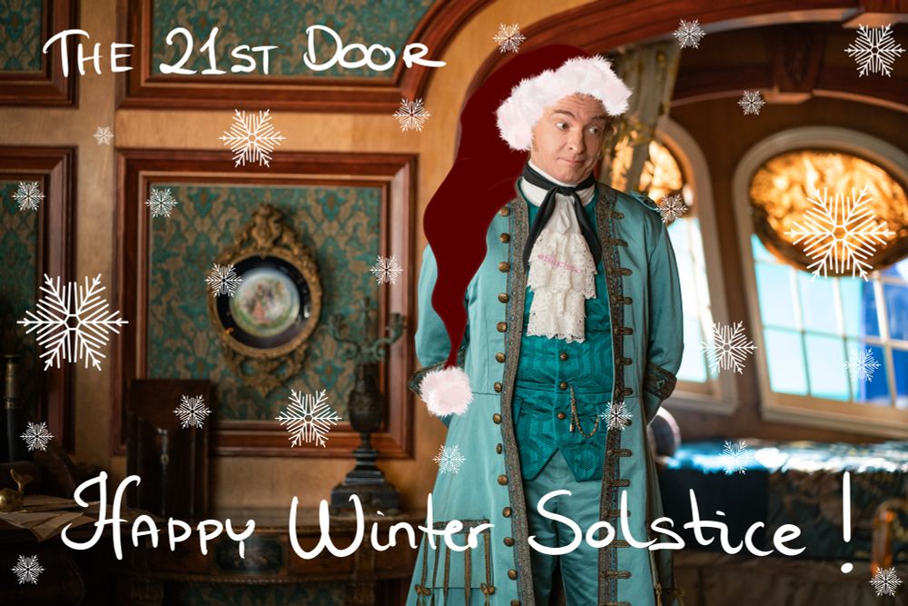 Digitally altered production still of Stede from episode 1 season 1 of Our Flag Means Death. He’s standing in the captain’s cabin, wearing the teal suit.

The image has been digitally altered (by @tillythmo) by drawing a Santa hat on his head + adding a bunch of snowflakes everywhere but on his face.

Handwritten text at the top left-hand corner reads: “THE 21ST DOOR”

Handwritten text at the bottom of the image reads: “HAPPY Winter Solstice!”.