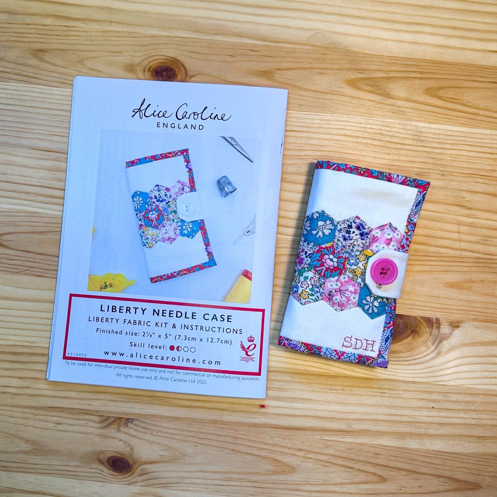 Alice Caroline Liberty needle case with stitched monogram on the cover.