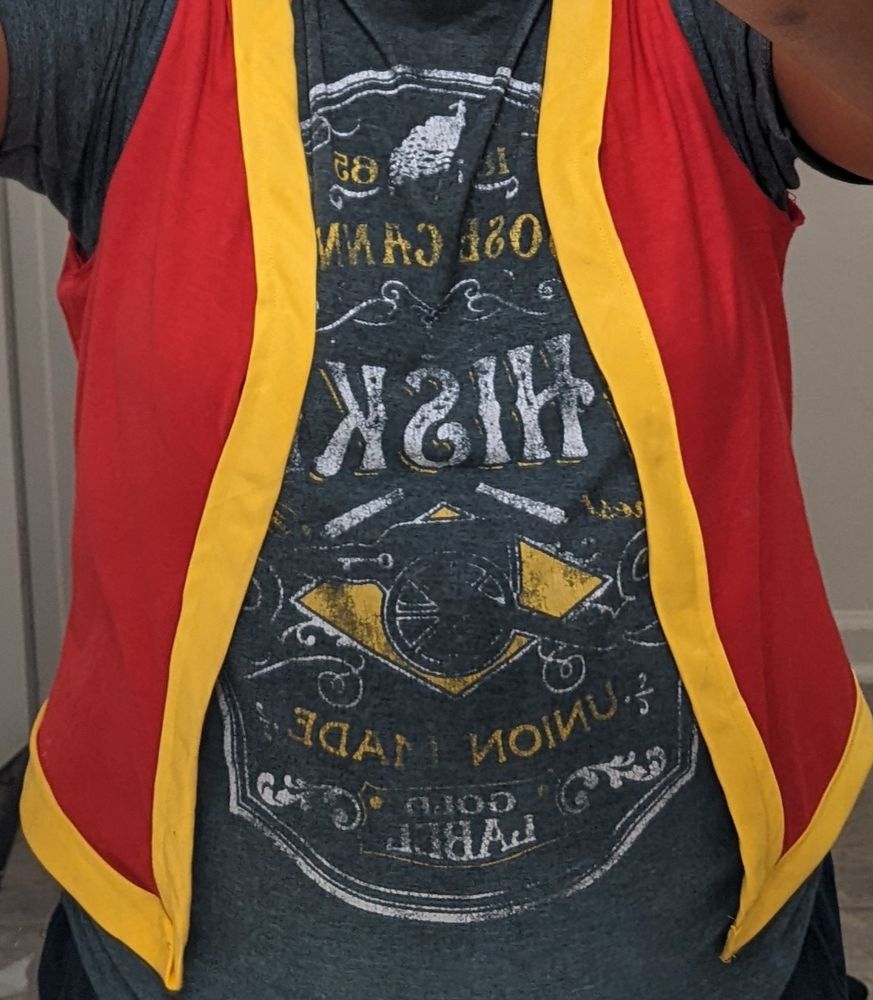 Me in a red vest with yellow trim 