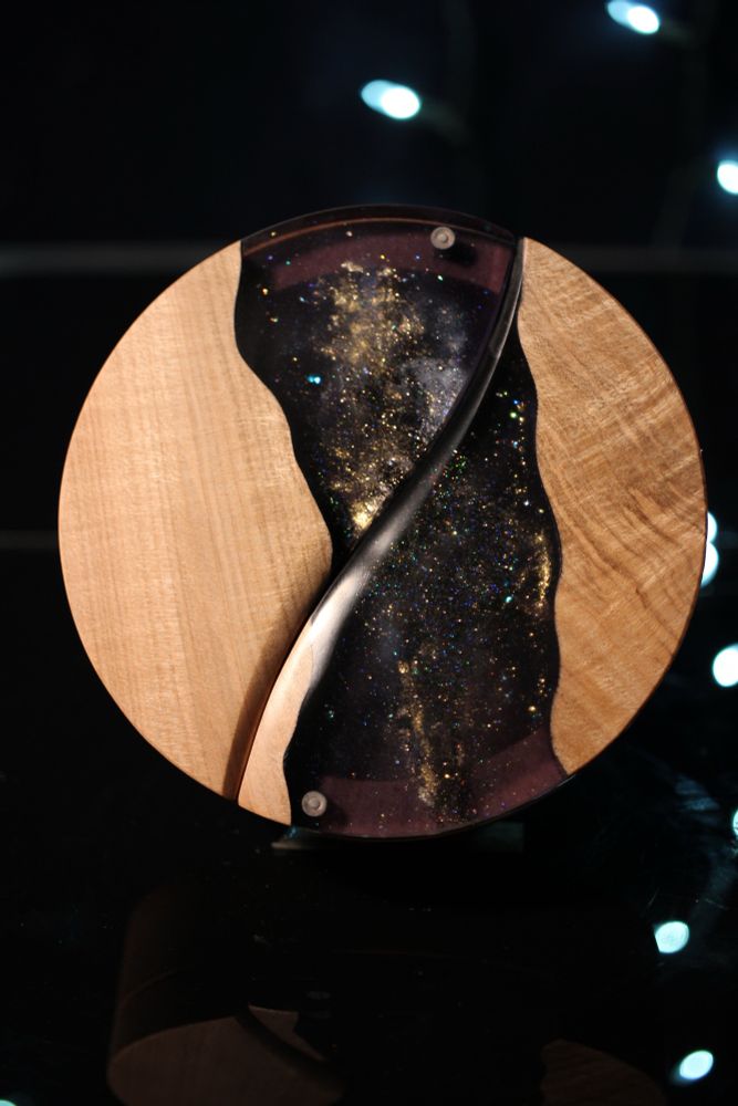 Round maple dice boxes with a channel of epoxy that looks like the Milky Way on a clear night 