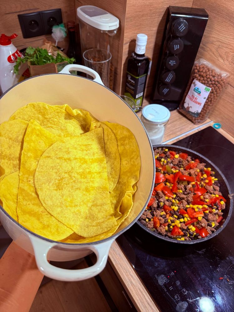 A casserole pot lined with corn tortillas.