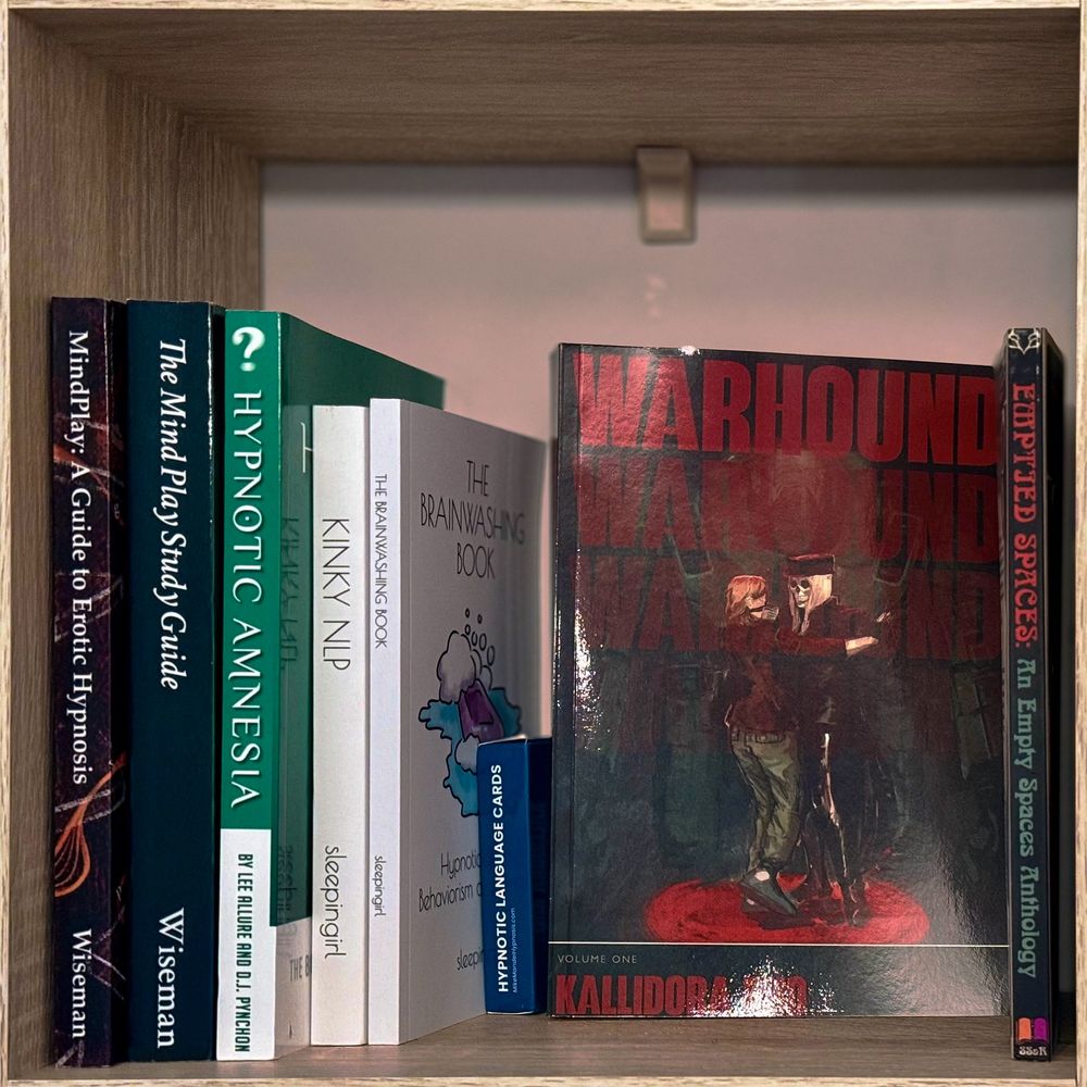 WARHOUND: VOLUME ONE sitting proudly between:

- Mind Play: A Guide to Erotic Hypnosis and The Mind Play Study Guide by Mark Wiseman
- Hypnotic Amnesia by Lee Allure and DJ Pynchon
- Kinky NLP and The Brainwashing Book by sleepingirl
- Mike Mandel's Hypnotic Language Cards
- EMPTIED SPACES: An Empty Spaces Anthology