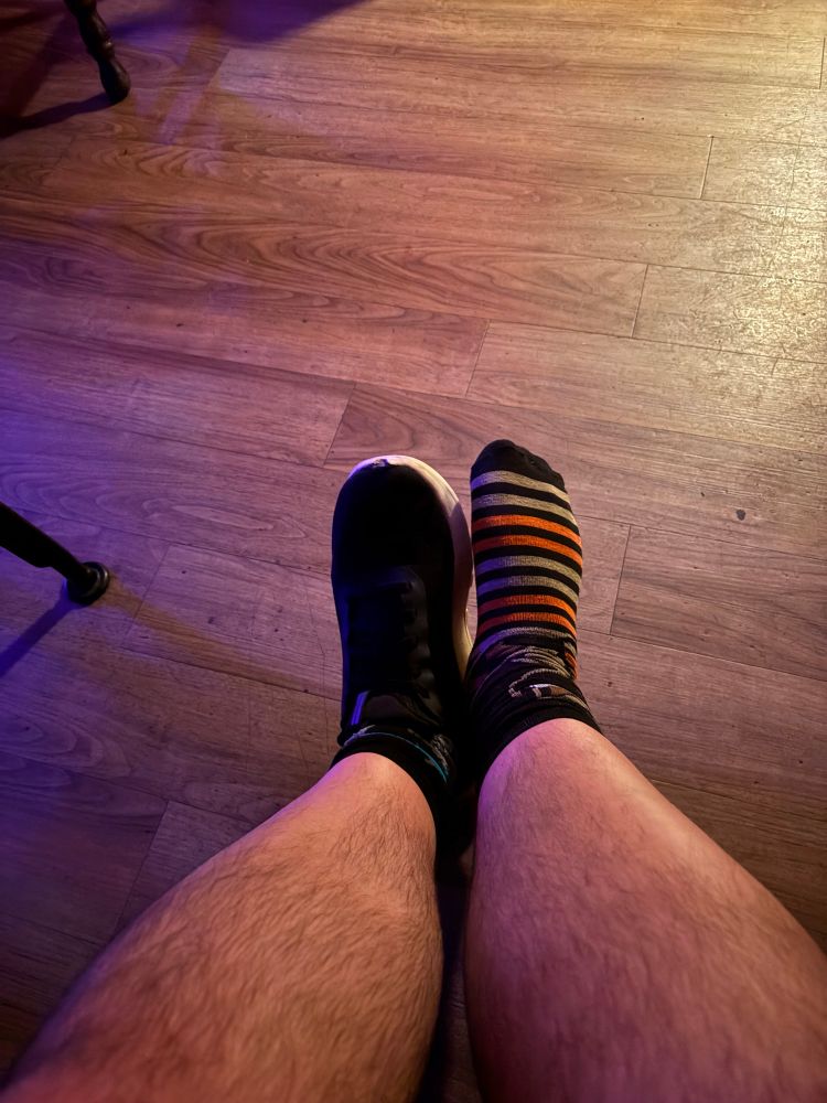 My feet with one shoe and one sock