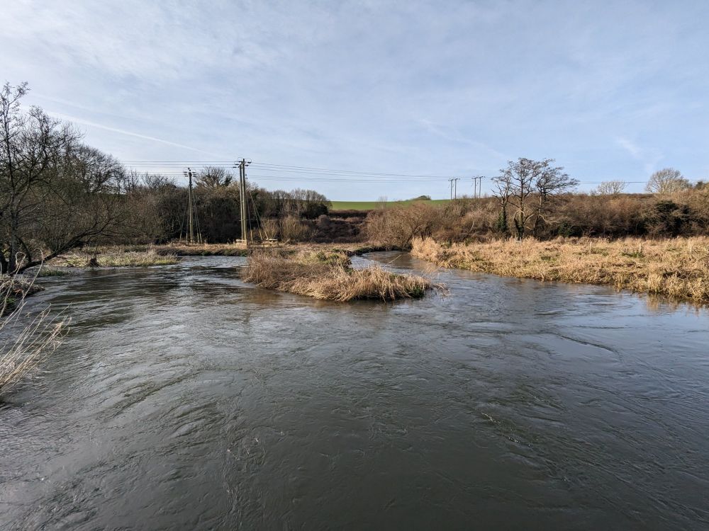 One of the meanders of the Dorset Frome shown on the map. The winter river is in full flow.