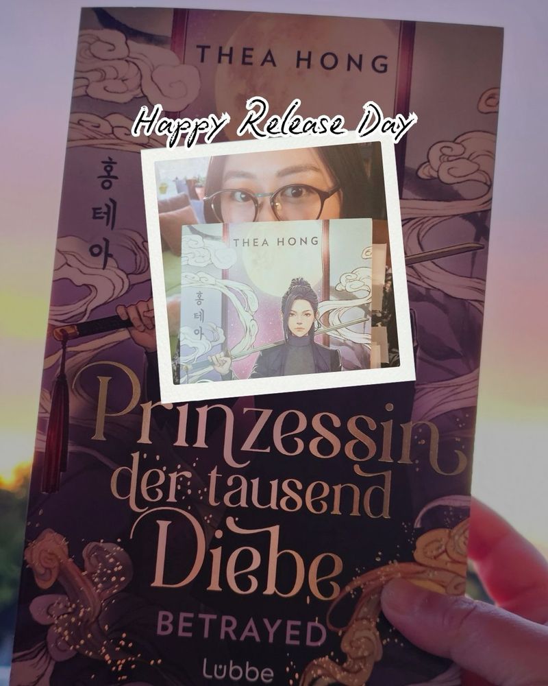 The image features a book titled "Prinzessin der tausend Diebe" with the subtitle "Betrayed" by Thea Hong. There is a smaller inset photo of a person holding the book and smiling, surrounded by a background that suggests
