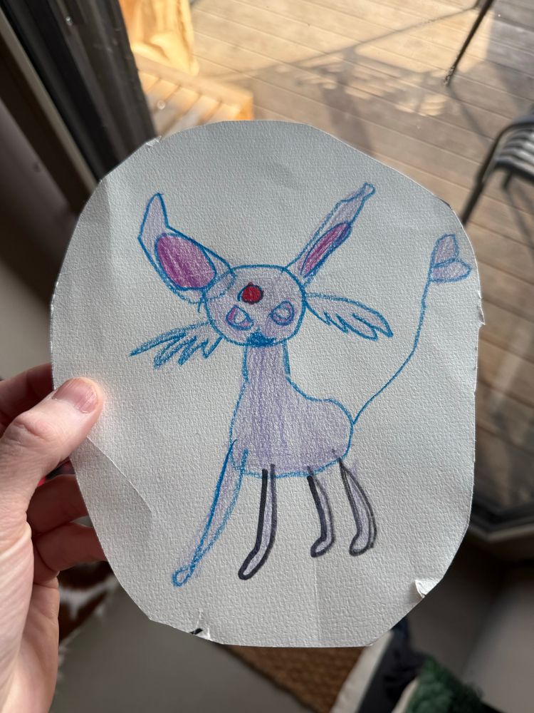 A photograph of a child’s drawing of a Pokémon.