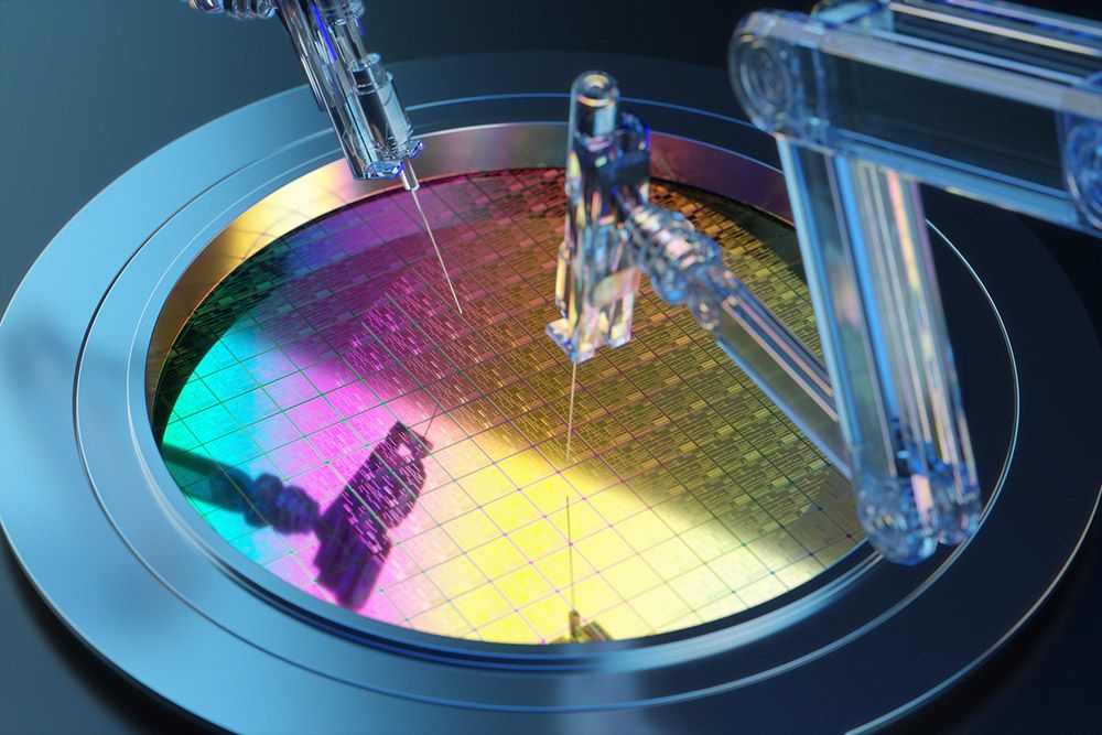 Robotic arm engaged in a semiconductor manufacturing process on a colorful silicon wafer.