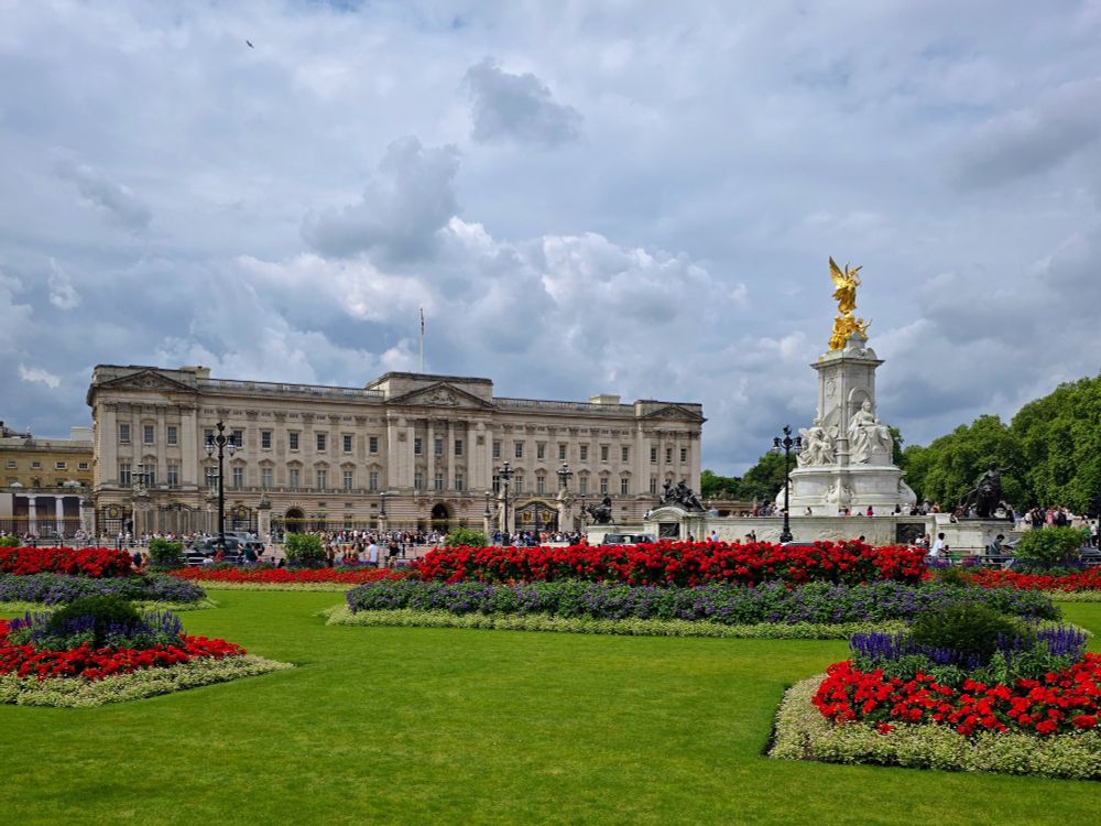  Buckingham Palace, with flowers in bloom. London, UK.