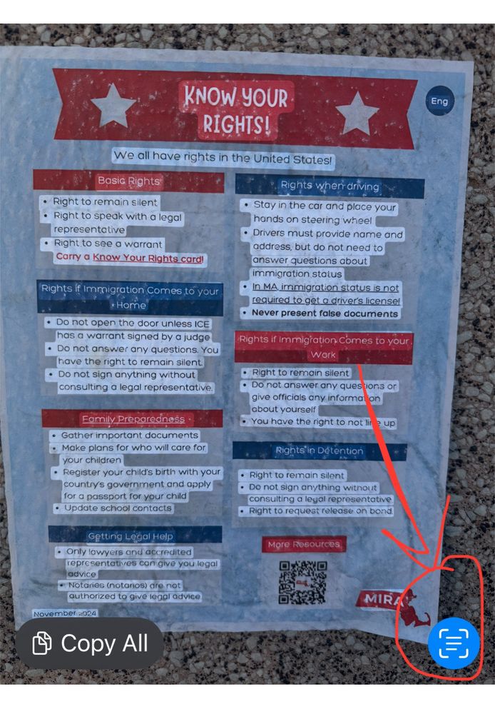 Screenshot showing a photo of a poster, with all text highlighted in the photo. The "text" icon at bottom right is circled with an arrow pointing to it. 