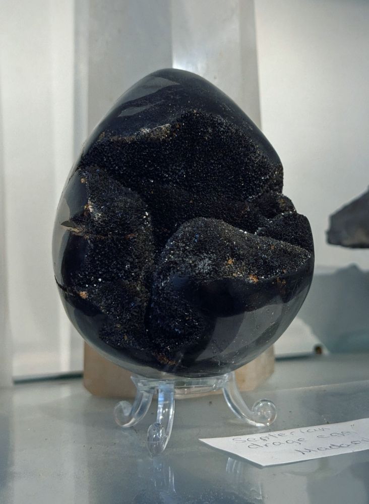 An egg-shaped obsidian geode