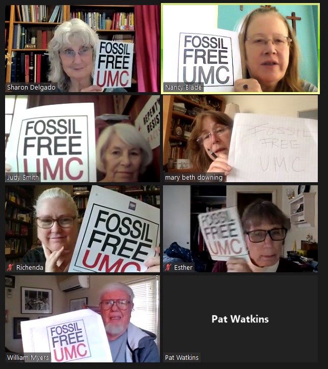 Participants in a Zoom hold Fossil Free UMC signs.
