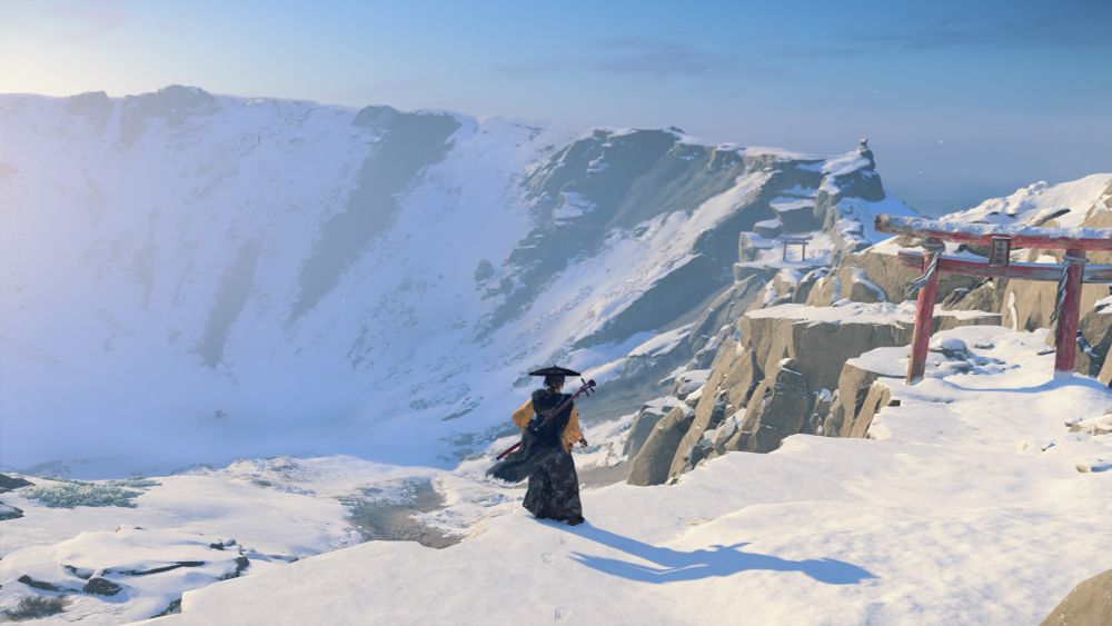 The peak of Mt Yotei from the ridge around the edge. Atsu is in the center and there's a red torii gate on the right.