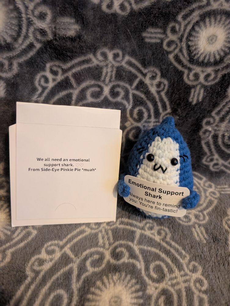 Cute knitted/crocheted Emotional support shark with a note.