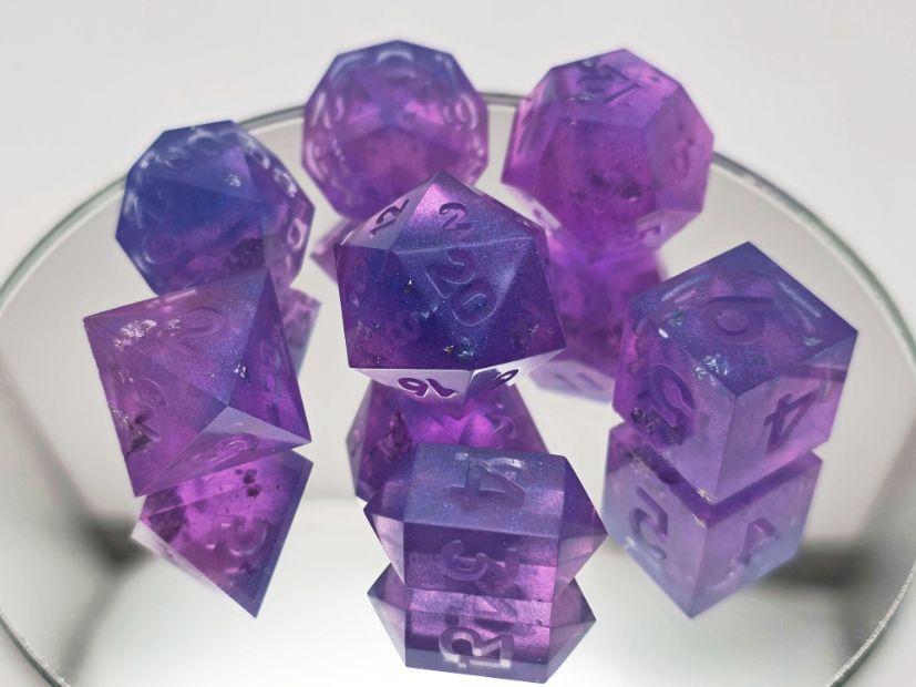A 7 piece set of electic and a darker purple with blue mica powder and bits of silver foil inside of them. They are not yet painted.