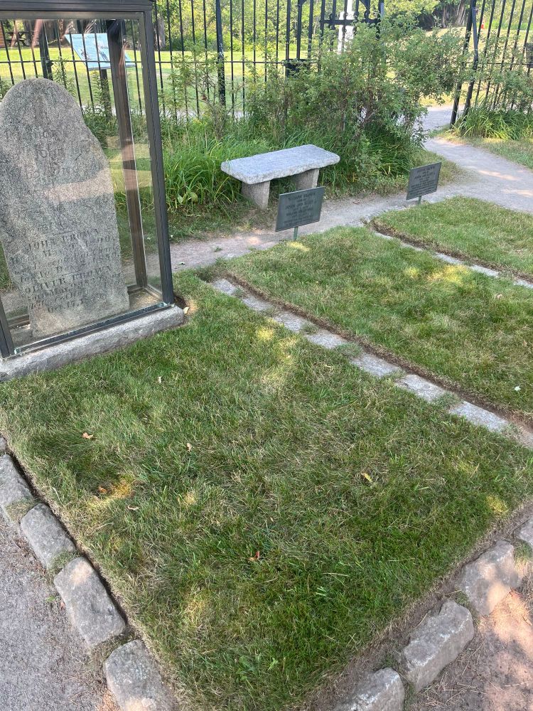Image with John Brown gravestone and the two adjacent graves of his sons killed during the Harper’s Ferry Raid.