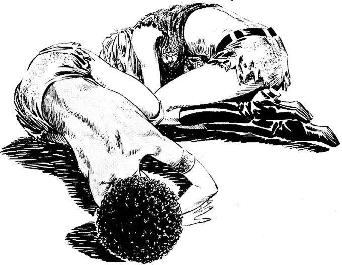 Two young women crouch’s on the floor in ragged clothes