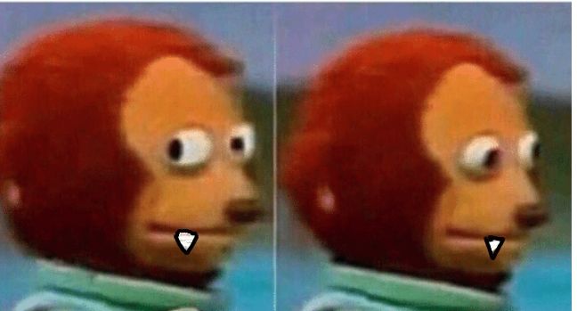 A meme of a puppet looking guilty, with vampire fangs poorly drawn on