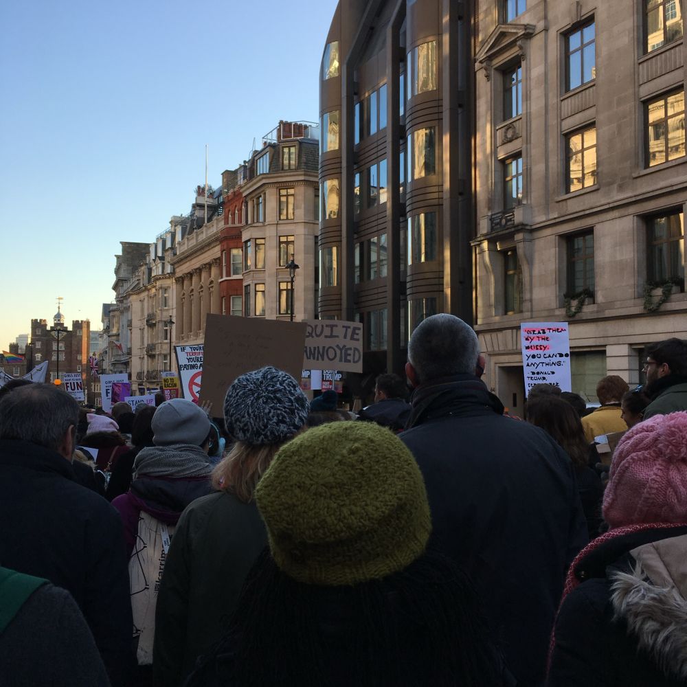 Crowded protest march on a London street