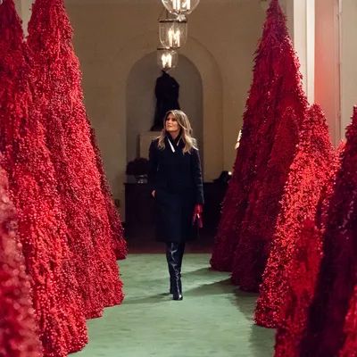 The first lady, Melania Trump, surrounded by blood-soaked Christmas trees