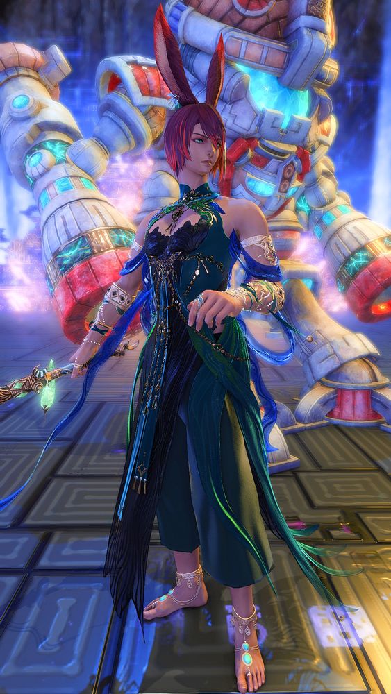 Drayden is standing in the deepest chamber of the Skydeep Cenote with a Yok Huy construct towering above him. He is wearing a green and blue silk outfit, adorned with myriad jewels and stones, and he is wielding a sword with bright green jewels embedded within.