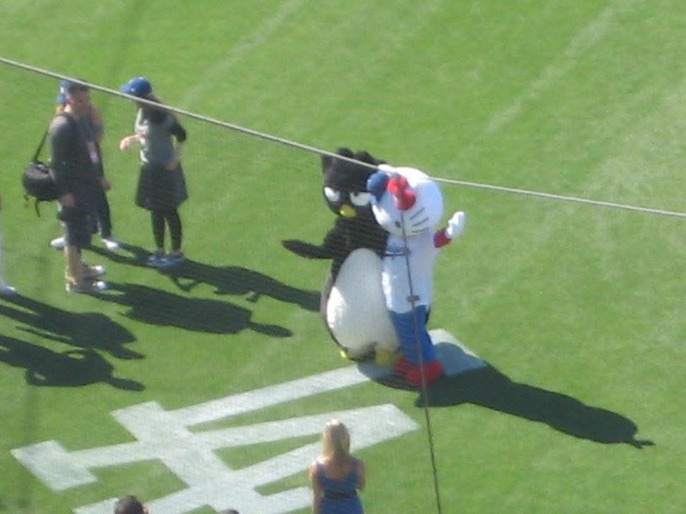 Badtz Maru (no jersey or cap) and Hello Kitty in a Dodgers cap and jersey at Dodger Stadium 