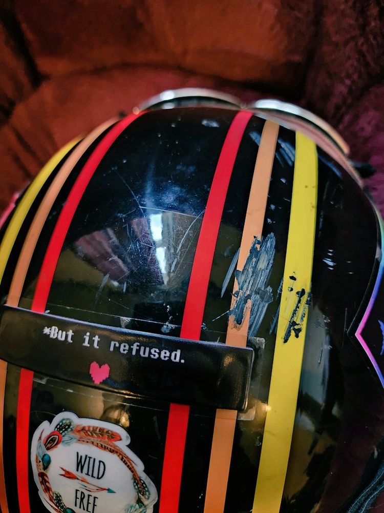 "But it refused." and "SAVE" stickers from Undertale on a motorcycle helmet after a crash, with impact marks directly between the two. Also Ralsei Deltarune was there, thanks Ralsei, flop with me again anytime