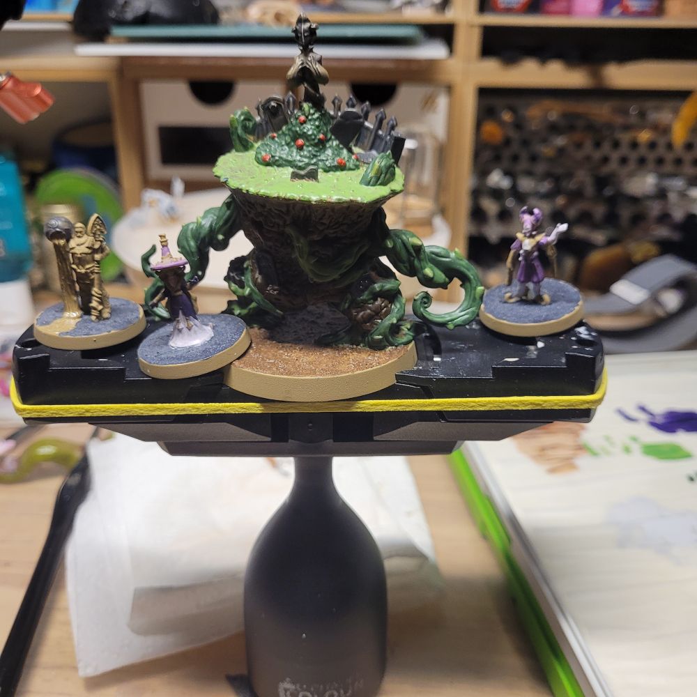 Figures on a large citadel paint handle. 