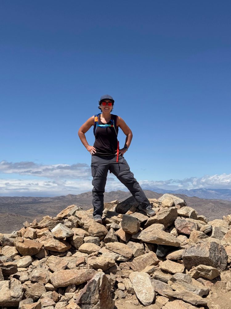 Me standing on a pile of rocks at Mt Ryan peak