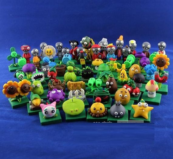 clay figures of plants vs zombies characters on a blue background