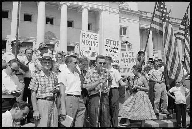 White racists protesting integration of Little Rock schools in 1959. Signs include "RACE MIXING IS COMMUNISM" and "STOP THE RACE MIXING MARCH OF THE ANTICHRIST."