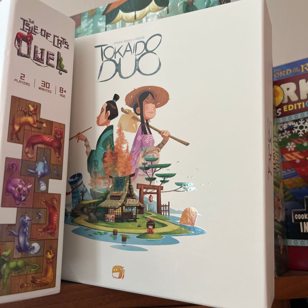 A copy of Tokaido Duo from Funforge on our game shelf.