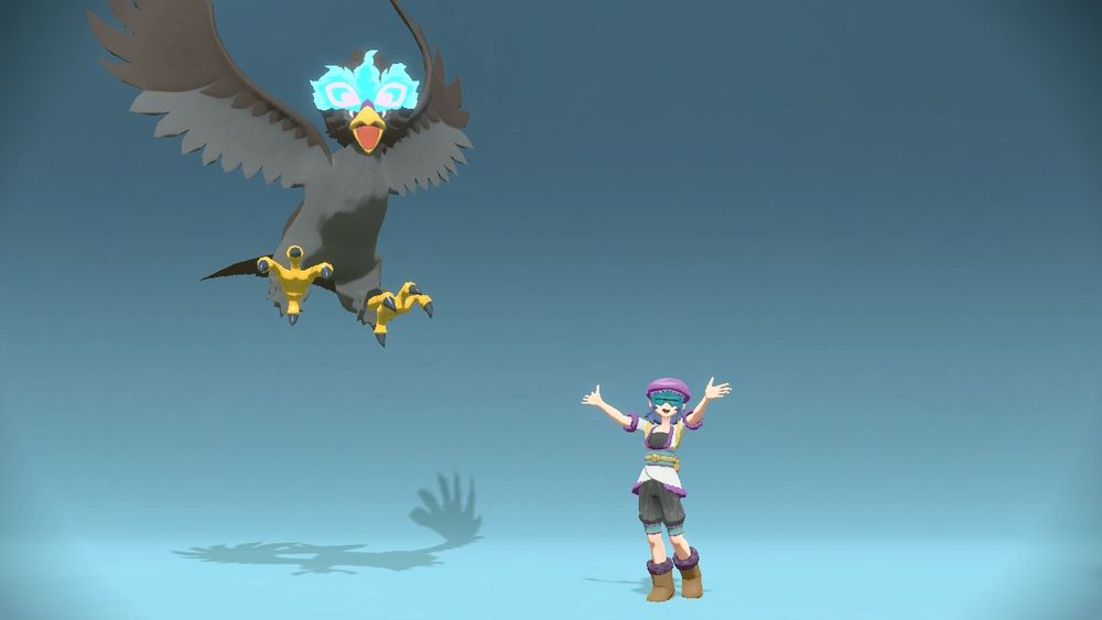 A screenshot from the photo studio in PLA. My trainer stands on the right with arms spread upward and a delighted expression. Braviary on the left is in a happy pose as well