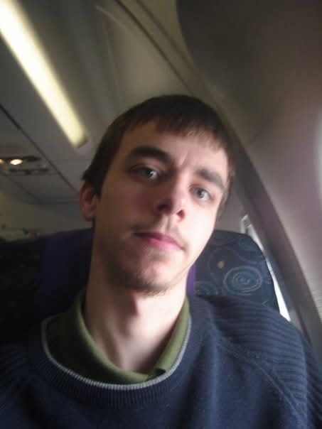 A photo of me in a plane seat in 2007. 