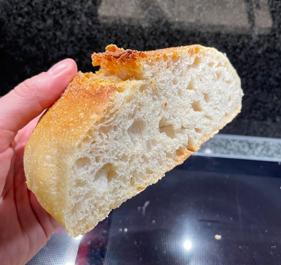 Loaf of sour dough bread cut in half.