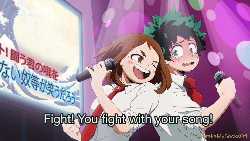 Izuocha doing karaoke, with Ochako looking triumphant and trying to motivate a nervous, apprehensive Izuku. Inspired by a cut scene Hori mentioned in an interview where the class would go to karaoke together and Ochako would sing encouragement to Deku (this scene was scrapped but eventually inspired the scene of Ochako on the rooftop with the megaphone). The song they're singing is "Fight!" by Miyuki Nakajima! 