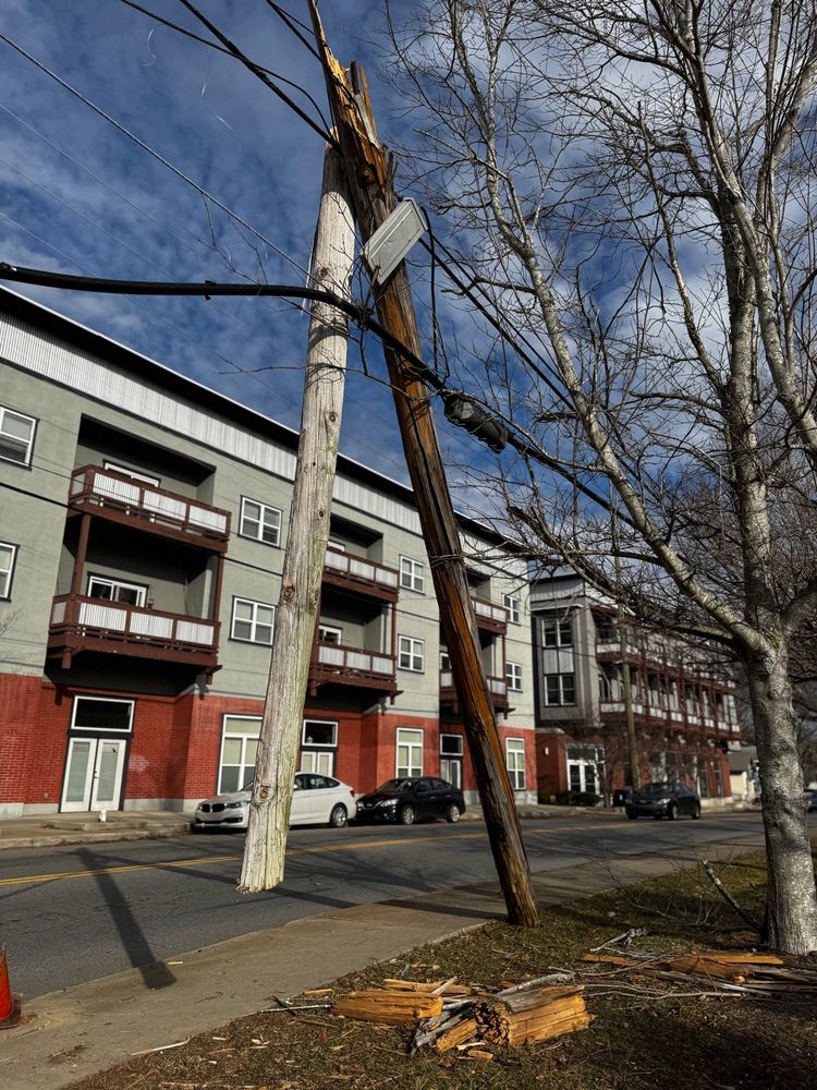 A smashed telephone pole suspended mid-air. 