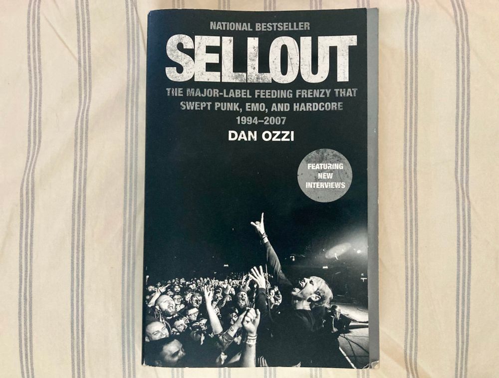 Book cover for SELLOUT: The Major-Label Feeding Frenzy that Swept Punk, Emo, and Hardcore 1984-2007

It’s a black and white cover and the image is a whole bunch of white folks going crazy at a concert