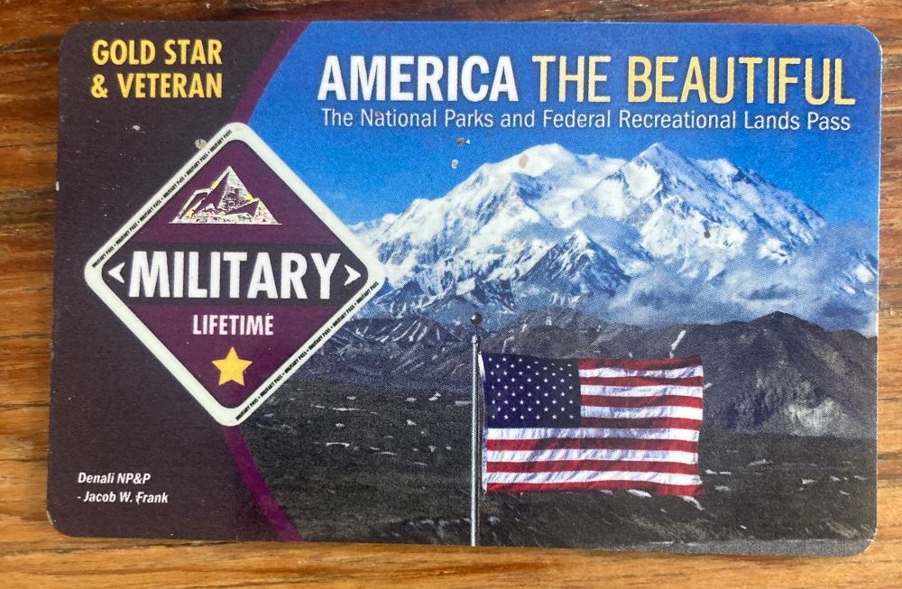 Card with snow-capped mountains and an American flag