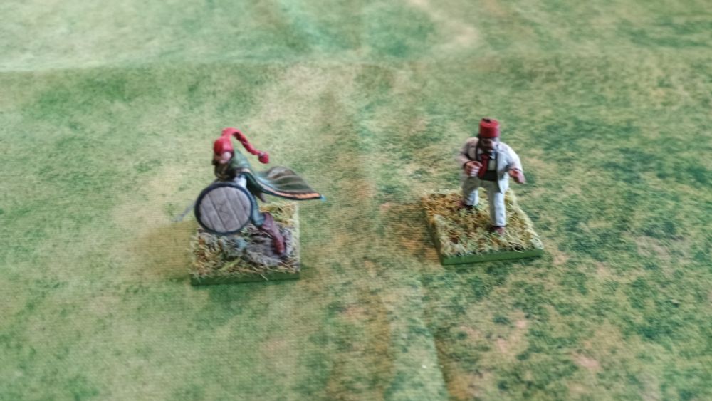 2 28mm figures: A figure to represent Tauriel from The Hobbit movies and a figure for Sallah from Raiders of the Lost Ark.