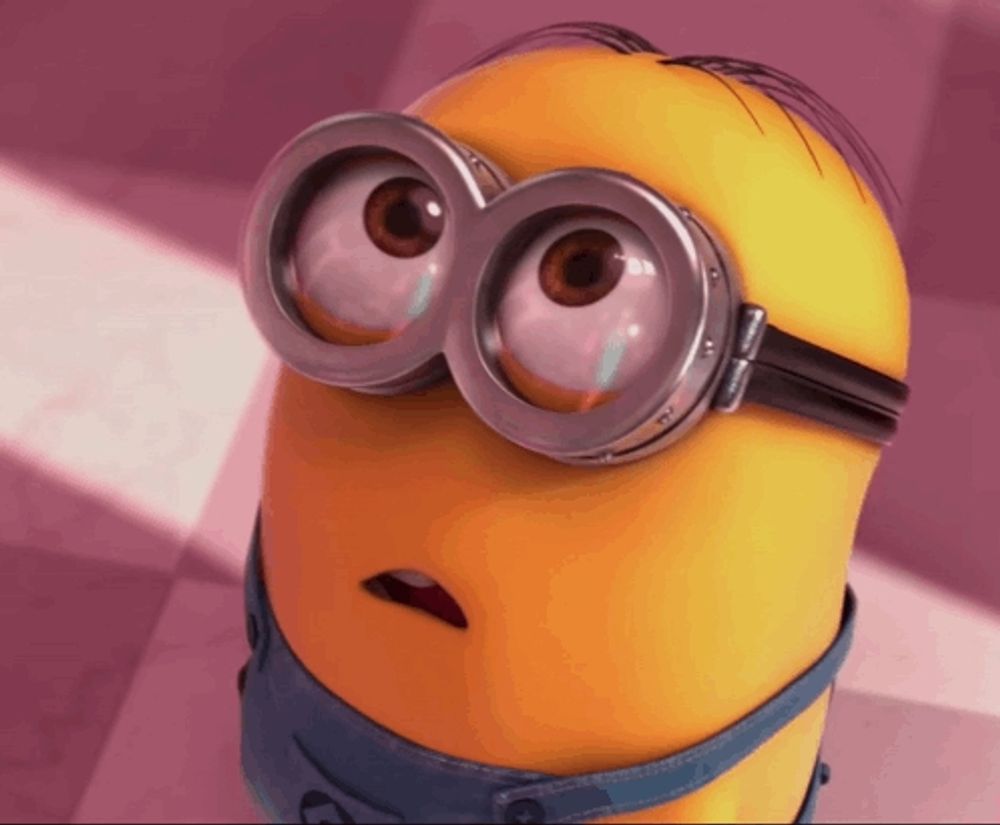 a close up of a minion wearing goggles with two eyes