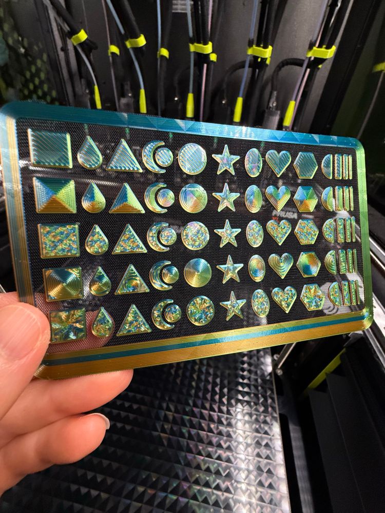 A 3D printed design with different shapes repeated in rows. Each row of shapes has been printed with a different infill pattern to show the difference in appearance. 