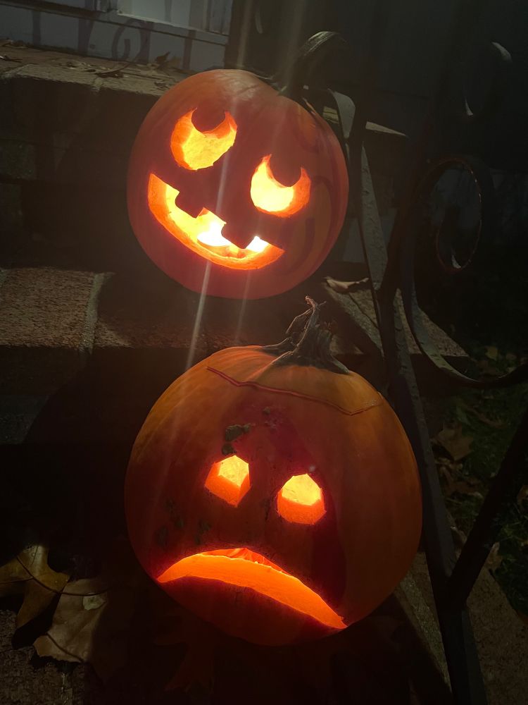 Two Jack-o-lanterns carved with varying artistic ability